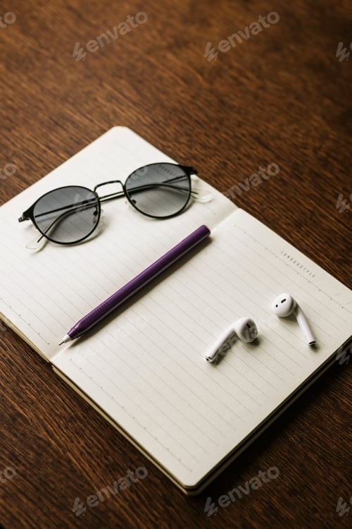 Preview: Plan the trip. Workplace with office staff: notebook, maps, pencil and headphones. Work background