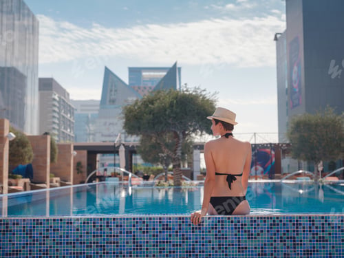 Preview: asian woman relaxing in swimming pool spa