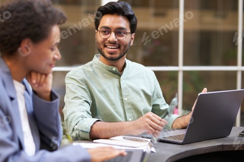 Preview: Group of office workers working on the terrace. Teamwork concept . High quality photo