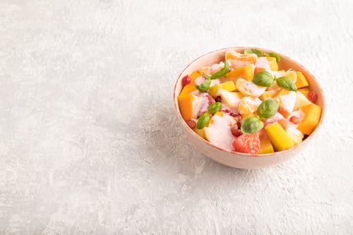 Preview: Vegetarian fruit salad of yogurt pumpkin, tangerine, pomegranate, grapefruit, basil microgreen
