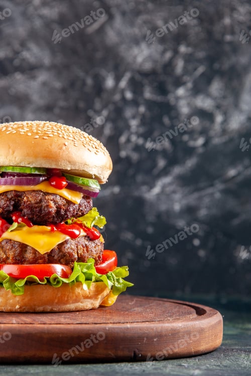 Preview: Top view of tasty sandwich on wooden cutting board on dark color background with free space