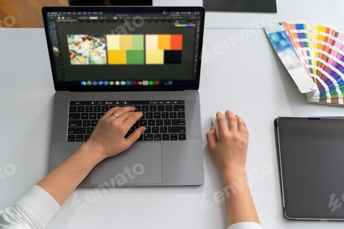 Preview: Close-up of hands of business woman on laptop keyboard