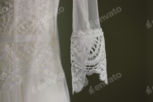 Preview: Detail of the fabric of a white wedding dress.