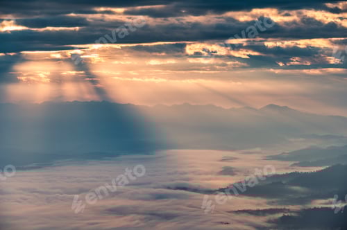 Preview: Beautiful dramatic sunrise shining on mountain with foggy in the valley at national park