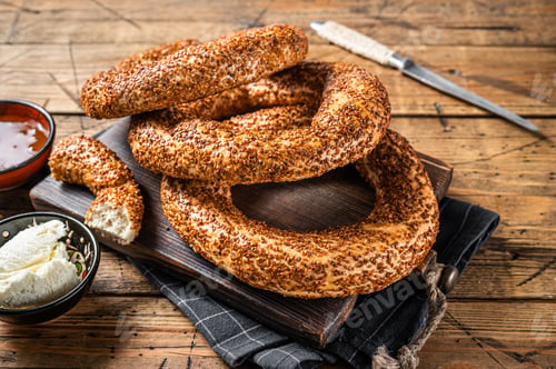 Preview: Traditional turkish breakfast with Bagel Simit, kaymak and honey. Wooden background. Top view