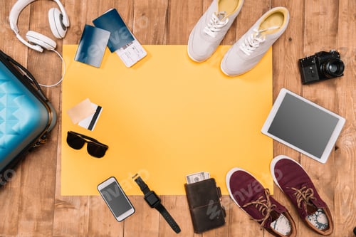 Preview: Summer holiday background with traveler's accessories on wooden floor