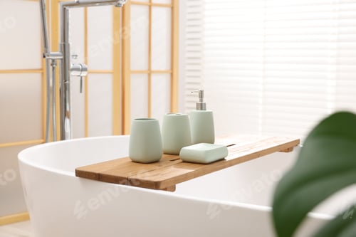 Preview: Set of bath accessories on tub in bathroom
