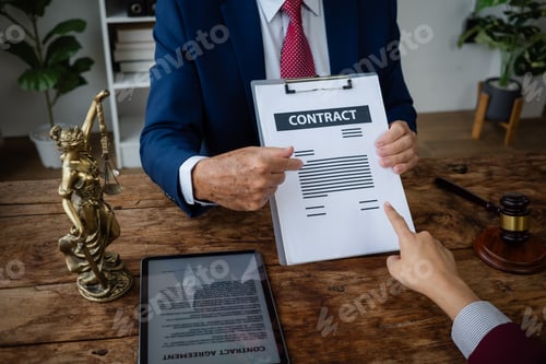 Preview: Lawyer advising client about contract terms and signature