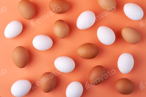 Preview: Flat lay white and brown chicken eggs.