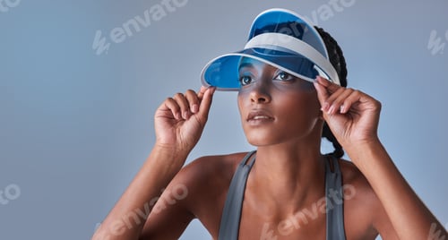 Preview: Studio shot of a fit young woman posing against a grey background