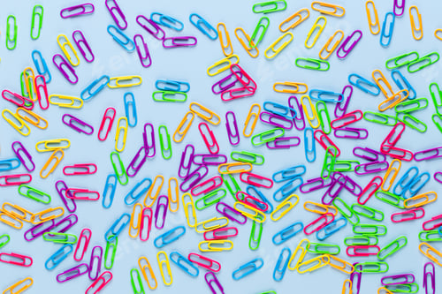 Preview: Paper color clip notebook on blue background. Flat lay.