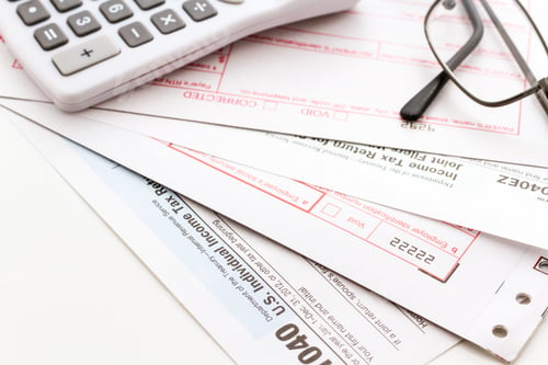 Tax Forms with Calculator and Eyeglasses