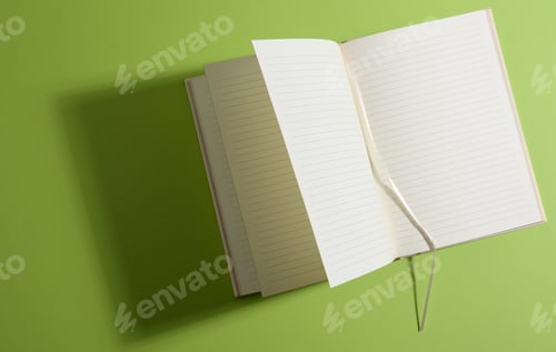 Preview: Open notebook with blank white sheets on green background