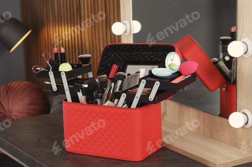 Preview: Beautician case with professional makeup products and tools on dressing table