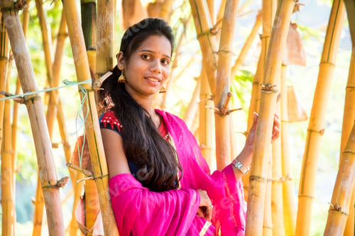 Preview: Happy smiling girl in bamboo forest.