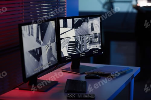 Preview: Security Monitors Showing Surveillance Footage of Urban Areas