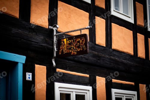 Preview: Low angle shot of an atelier sign on a building