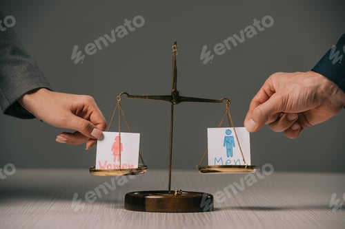 Preview: cropped view of businesspeople with male and female signs on scales of justice, gender equality