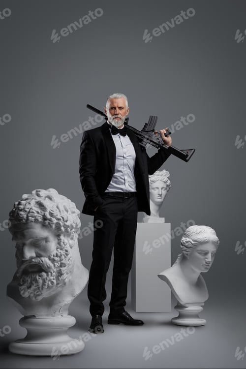 Preview: Stylish older man holding a gun stands surrounded by three ancient sculptures