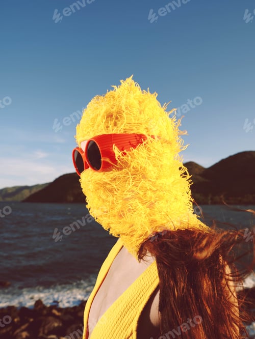 Preview: Woman, yellow dress, sunglasses, water, mountain a woman in a bright yellow dress and sunglasses