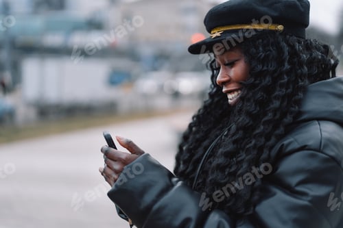 Preview: Afro girl uses the phone on the outdoors. People using technology