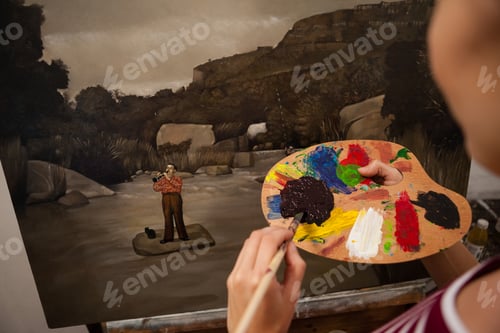 Preview: Woman painting on canvas in drawing class