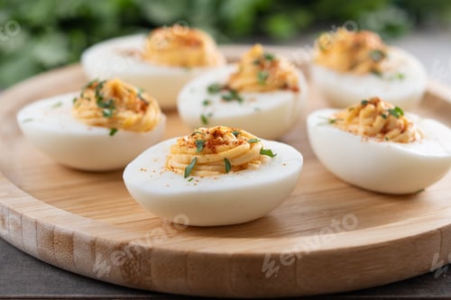 Preview: Homemade hard Boiled Deviled Eggs garnished with herbs