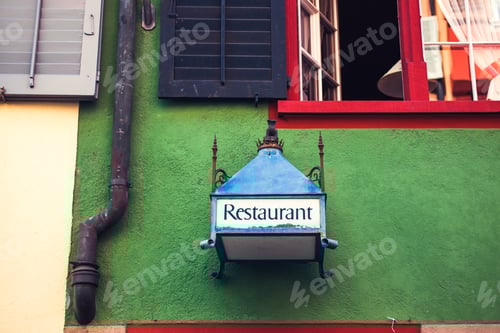 Preview: Old sign restaurant on green wall