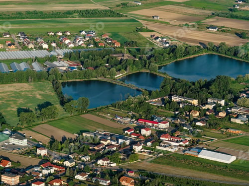 Preview: Beautiful village lake and trees farming lands and houses aerial view