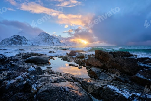 Preview: Coast of Norwegian sea on rocky coast in fjord on sunset