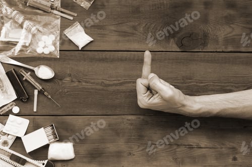 Preview: Male hand show FUCK sign to all of narcotic stuff definitions. M