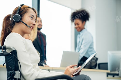 Preview: Friendly smiling woman call center operator with headset using computer.