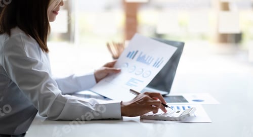 Preview: Business woman using calculator for do math finance on wooden desk in office and business working
