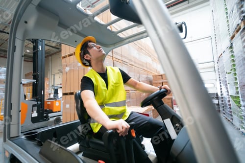 Preview: Warehouse worker operates a forklift