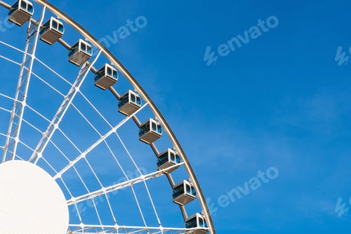 Preview: Closeup part of ferris wheel over the blur sky