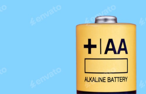 Preview: AA Alkaline electric battery closeup on blue background