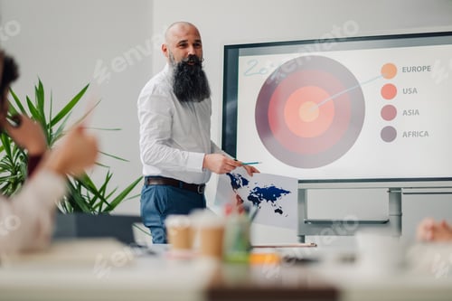 Preview: Businessman leading presentation about global markets in modern office