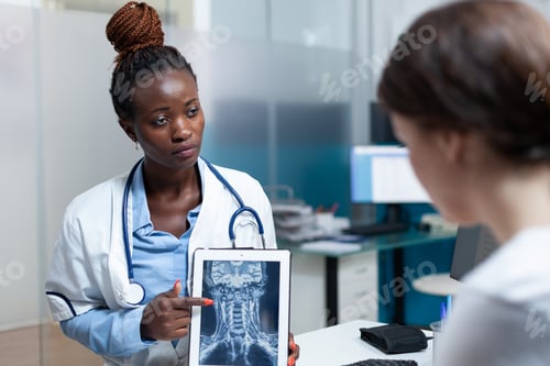 Preview: African american radiologist doctor discussing bones radiography