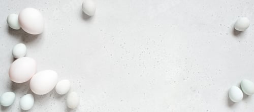 Preview: Banner with Easter eggs on the white table, tender light monochrome composition