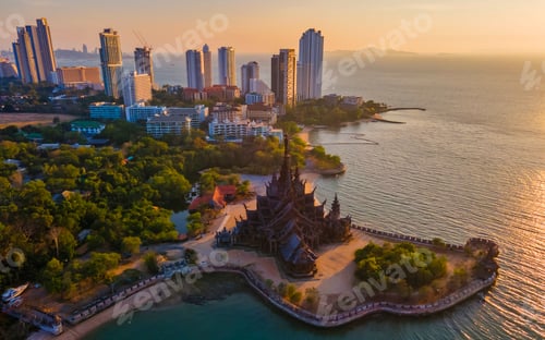 Preview: Sanctuary of Truth, Pattaya, Thailand, wooden temple by the ocean at sunset on the beach of Pattaya