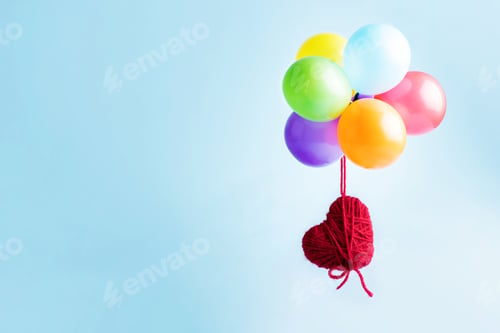 Preview: Red heart flying on colorful balloons on a blue background, Valentine's Day card.