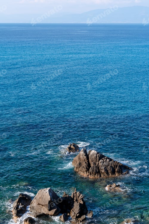 Preview: Waves on rocky beach, sea shore with waves crushing over the big rocks