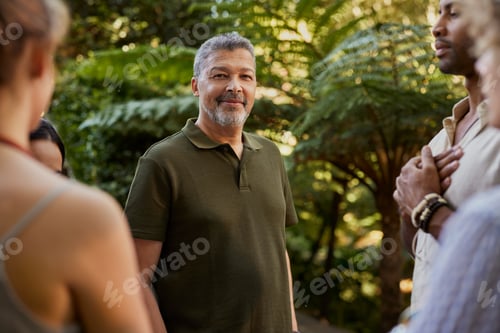 Preview: Portrait of middle aged man at meditation retreat