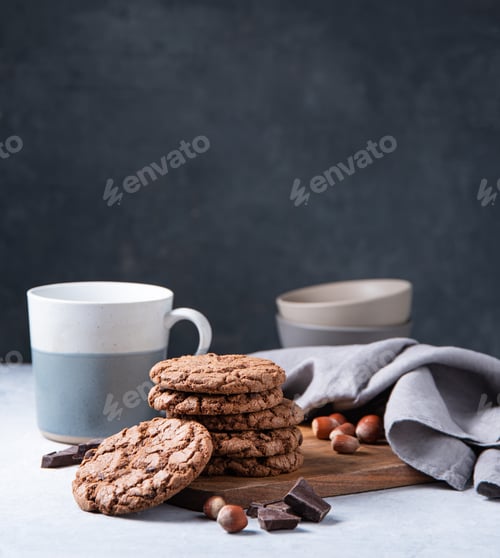 Preview: Chocolate Cookies with Hazelnuts and a White Mug