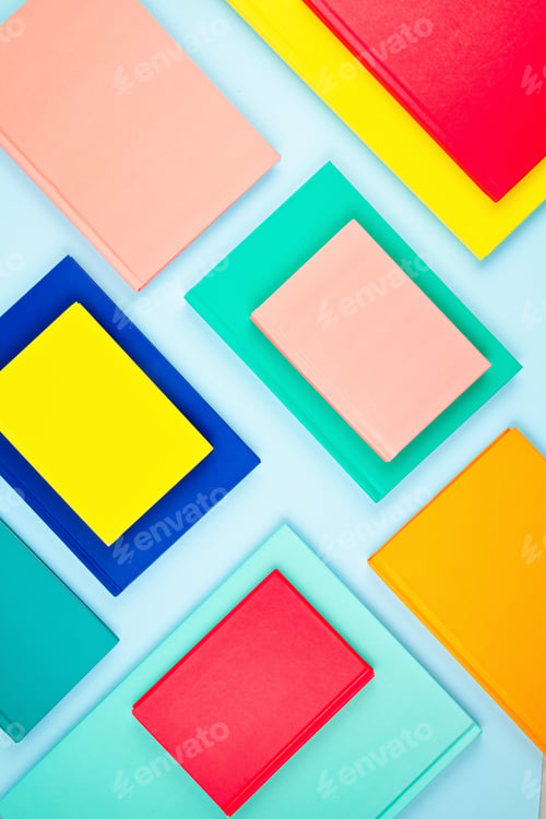 Preview: Colorful notebooks over the blue pastel background. Modern abstract working space