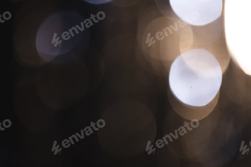 Preview: White and blue bokeh lights with copy space on dark background