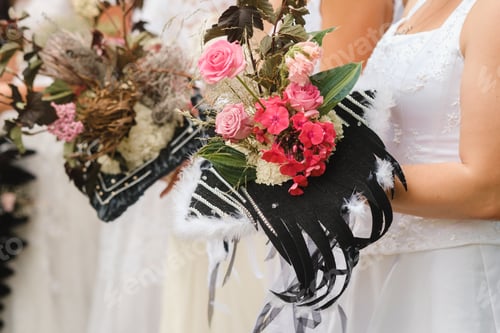Preview: The bride holds her wedding bouquet in her hands