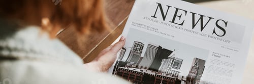 Preview: Woman reading paper news
