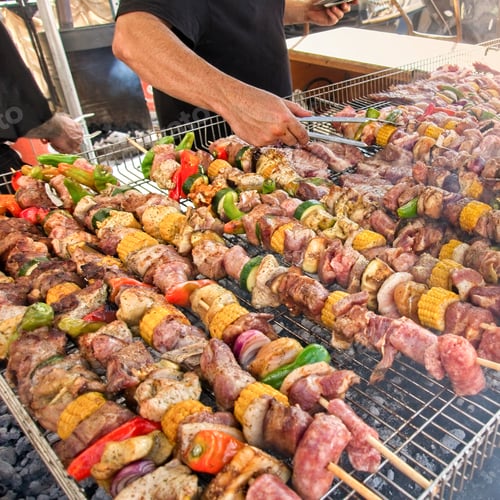 Preview: Skewers of mixed meats and vegetables cooked on the grill.