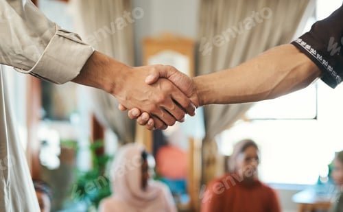 Preview: Its so good to see you again. Shot of two muslim men shaking hands in greeting.